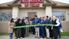 ribbon cutting outside the office