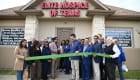 ribbon cutting outside the office