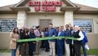 ribbon cutting outside the office