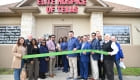 ribbon cutting outside the office