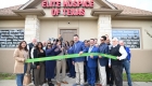 ribbon cutting outside the office