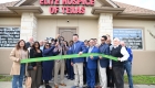 ribbon cutting outside the office