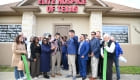 ribbon cutting outside the office