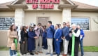 ribbon cutting outside the office